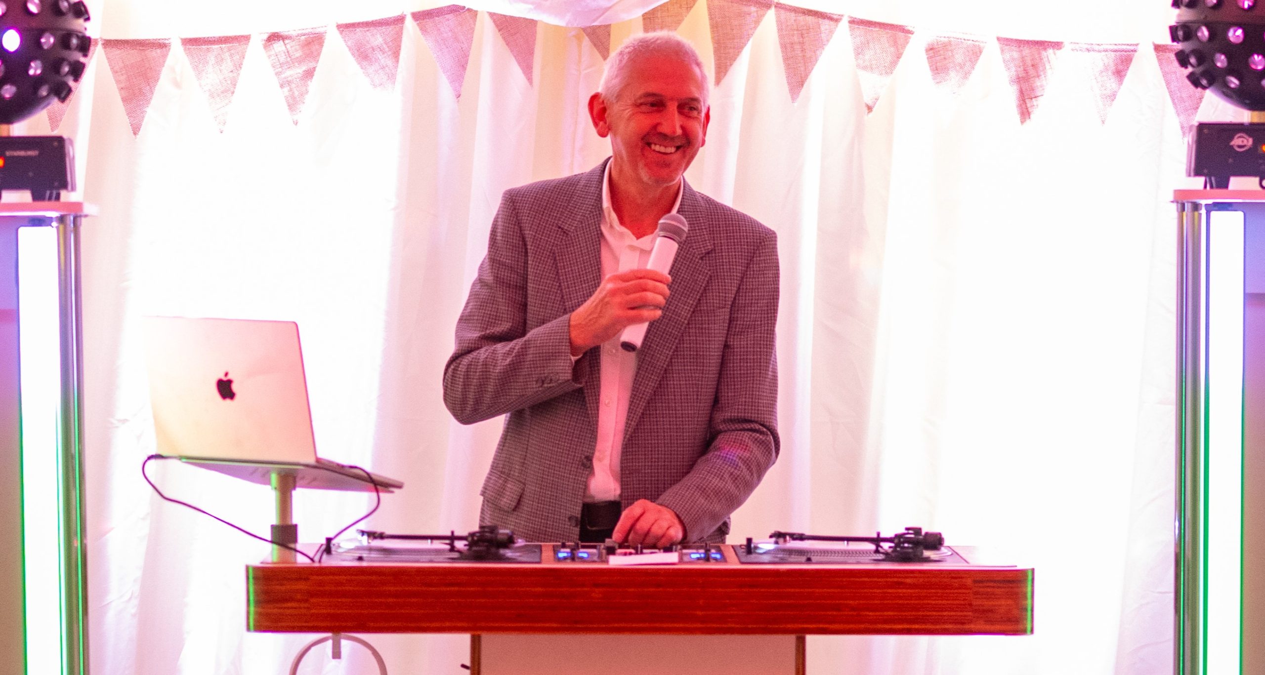 Martin Eccles hosting an event with a microphone